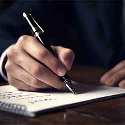 Free Business Image of Man Writing in Notebook